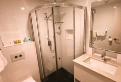 Modern ensuite bathroom with shower and vanity